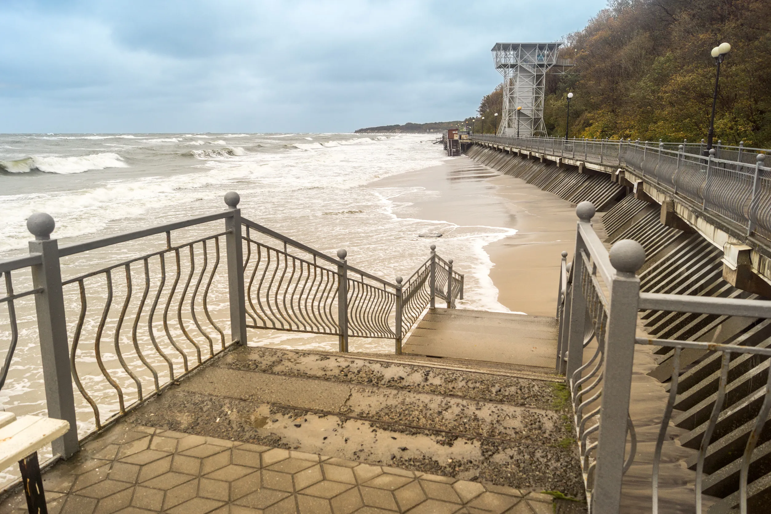 Stairs leading to the sandy beach next to the promenade