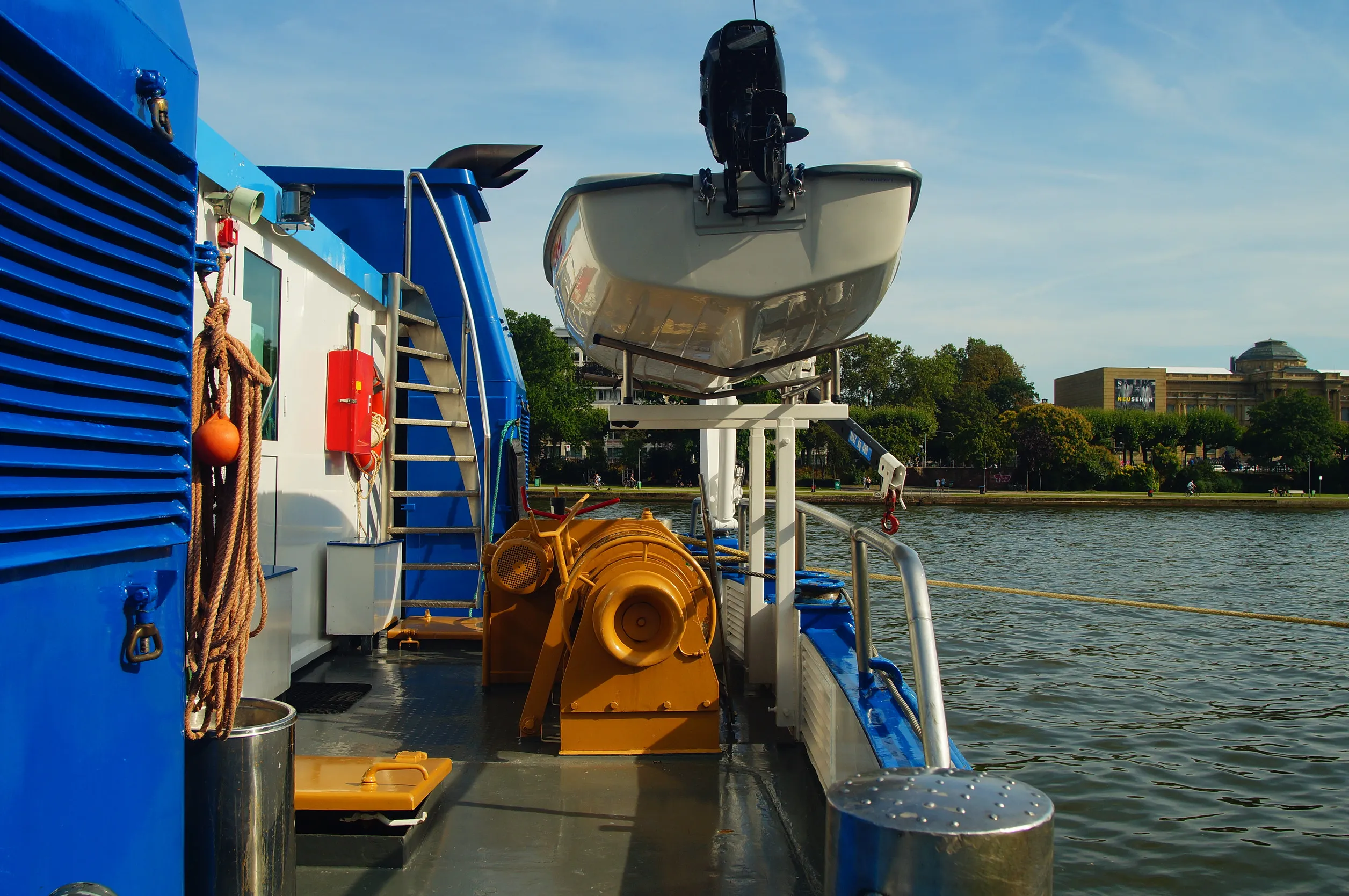 Stern of a river cruise ship with winch and lifeboat on the river Main in Frankfurt